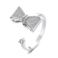 Silver plated spinner bow ring with sparkling zircons and adjustable open band design - Bowknot Spinner