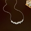 Detail showing sparkling water-drop zircon necklace with silver chain on leather background - Silver Zircon Streamline Cluster (18#)