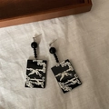 Close-up of bamboo-style tassel earrings with white crane and pine tree art design - 925 Sterling Silver Earring Post (2) / Black