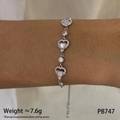 Silver heart bracelet with mother of pearl inlay and sparkling zircon on woman's wrist - Heart Silver