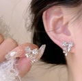 Orecchini a fiocco argento con strass scintillanti e sottili catenelle a nappa - Stile Nappa Stella Argento (HE27397)