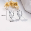 Detailed size view of silver stud earrings featuring 10x6mm oval clear zircon stones - EH763 Oval Solitaire Studs