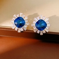 Detailed close-up of sunflower earrings with blue square stone and zircon accents - Gold Deep Blue