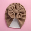 Detail of baby turban hat featuring a large 3D bow in soft camel cashmere-like fabric - 18*21cm / Khaki