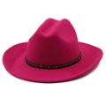 Detail of fuchsia felt cowboy hat with wide brim and gold studded black ribbon band - Rose Red