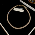 Detail of champagne gold rhinestone mesh necklace on black velvet with gift card - Round / Gold / Necklace