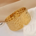 Macro detail of gold hammered texture wide bangle with spring hinge closure - Gold Wide Hammered (1163-1)