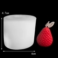 White silicone strawberry candle mold with red finished candle showing 6cm x 4.7cm dimensions - H63 Small Strawberry