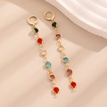 Detailed shot of long gold drop earrings with multi-colored round crystals in a linear design - KC Gold Multicolor Long Earrings (7231)