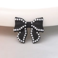Detail of black bow ornament with white pearl border for DIY crafts and accessories - Black