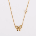 Detalle del collar con colgante de lazo dorado y un cristal brillante engastado - Dorado