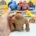Brown squishy gorilla stress relief toy being stretched by hand for slow rebound fun - Muscle Gorilla (250g) Bagged / Brown
