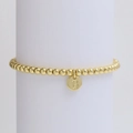 Detailed close-up of a gold-plated beaded bracelet featuring a round letter G pendant charm - Letter G (DB240603-G)
