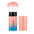 Macro view of retractable makeup brush with pink-blue gradient bristles and protective cap - Large Pink Gradient