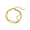 Detail van gouden dubbellaagse armband met slangenschakel en Cubaanse ketting en karabijnsluiting - Goud