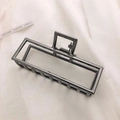 Macro view of gunmetal grey rectangular metal hair claw clip on white silk fabric - Gunmetal Black-Rectangular
