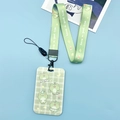 Green plaid card holder with a cartoon frog and a matching woven lanyard set - Grid Frog + Long Lanyard