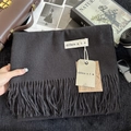 Close-up of dark grey cashmere-feel scarf with neat fringe and minimalist brand label - 200x68cm / Dark Gray