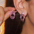 Elegant pink teardrop earrings with crystals, shown in hand and on ear for visual detail - Hollow Water Drop (DTE1216133-F1) / Pink