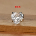 Macro shot of 8mm heart-cut clear zircon stud earring with four-claw titanium steel setting - 8mm Silver Tone White Style (E1611)
