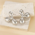 Modern silver flower earrings with 3-petal design on beige travertine stone display - Polished Three-Petal Flower / Silver