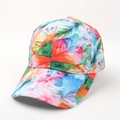 Close-up of 3D feather print details on a colorful tie-dye style baseball cap - Adjustable / Colorful Leaves