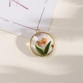 Handmade round alloy pendant with real yellow dried flowers and green leaves in gold frame - Style 17