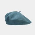 Detailed macro view of deep teal wool beret showcasing soft texture and fine fiber finish - Teal