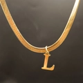 Flat snake bone necklace with golden letter L pendant made of stainless steel - Letter L (5592272000732)
