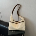 Retro cream woven bucket bag with brown faux leather trim and wide shoulder strap - Woven White Mesh