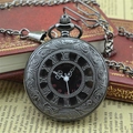 Vintage black roman numeral pocket watch with embossed pattern on a retro book - Gunmetal