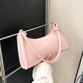 Pink glossy patent leather baguette bag with knotted handle detail and moon crescent shape - Pink
