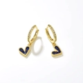 Detail of gold heart earrings with blue zircons and white crystals on polished metal - Ink Blue