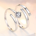 Detailed close-up of adjustable silver plated couple rings with sparkling center stones - Deeply In Love