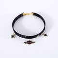 Detail of velvet pet choker featuring gold bat and star pendants with adjustable chain - XS (20-27cm) / Halloween Style