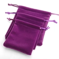 Three assorted sizes of purple velvet drawstring pouches for jewelry storage - Purple