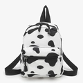 Cute cow print mini canvas backpack for women with front zipper pocket and cow pattern - Cow