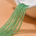 Detailed view of 2mm green faceted crystal beads for DIY jewelry making and crafts - Fruit Green