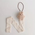 Detail of plush beige bunny on a cream cotton hanging organizer for children hair accessories - Milk Tea 3D Rabbit