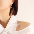 Elegant 3D geometric heart-shaped stud earrings in polished silver finish for women - Heart / Silver