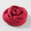 Solid red cotton linen scarf elegantly folded in flower shape for sun protection - Dark Rose Red