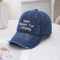 Distressed dark blue washed denim baseball cap with white embroidery in a minimalist setting - Dark Blue