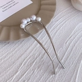 Elegant silver U-shaped hair fork featuring five graduated white pearls on a polished base - Curved Pearl Silver