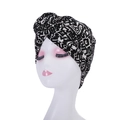 Detail of bohemian turban hat featuring black and white geometric patterns and floral knot - Style 2-Black & White Vintage Geometric