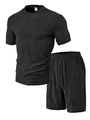 Close-up of fabric texture and collar label of men's black polo short set - S / Black
