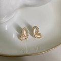 Elegant gold bow earrings with cat eye stones and small zircons on ceramic tray - 18K Gold Butterfly Style