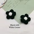 Handmade black crochet cotton flower with white center for DIY accessories and crafts - Black
