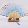 Blue gradient Japanese folding fan with pink cherry blossoms and wooden bamboo frame - White Ribs Style 20