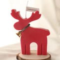 Red reindeer scented candle with golden bell on a wooden base for Xmas decor - Red Reindeer
