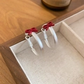 Detail shot of frosted round earrings with red bows inside a wooden jewelry box - 46# Red Bow Frosted Transparent Earrings